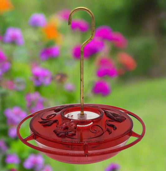 Red hummingbird feeder. with brass hanger
