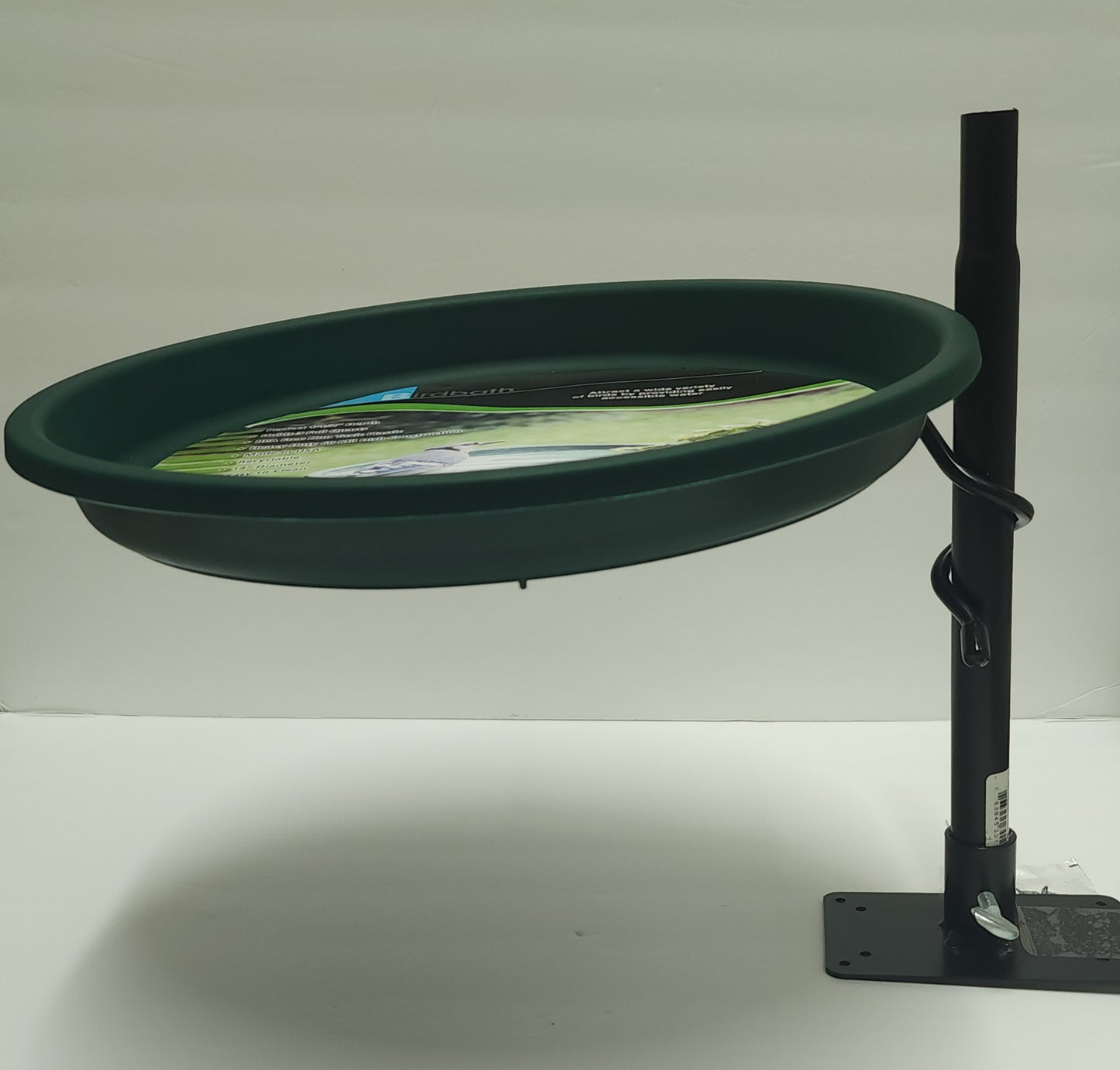 Black metal coil ring with green plastic insert bird bath