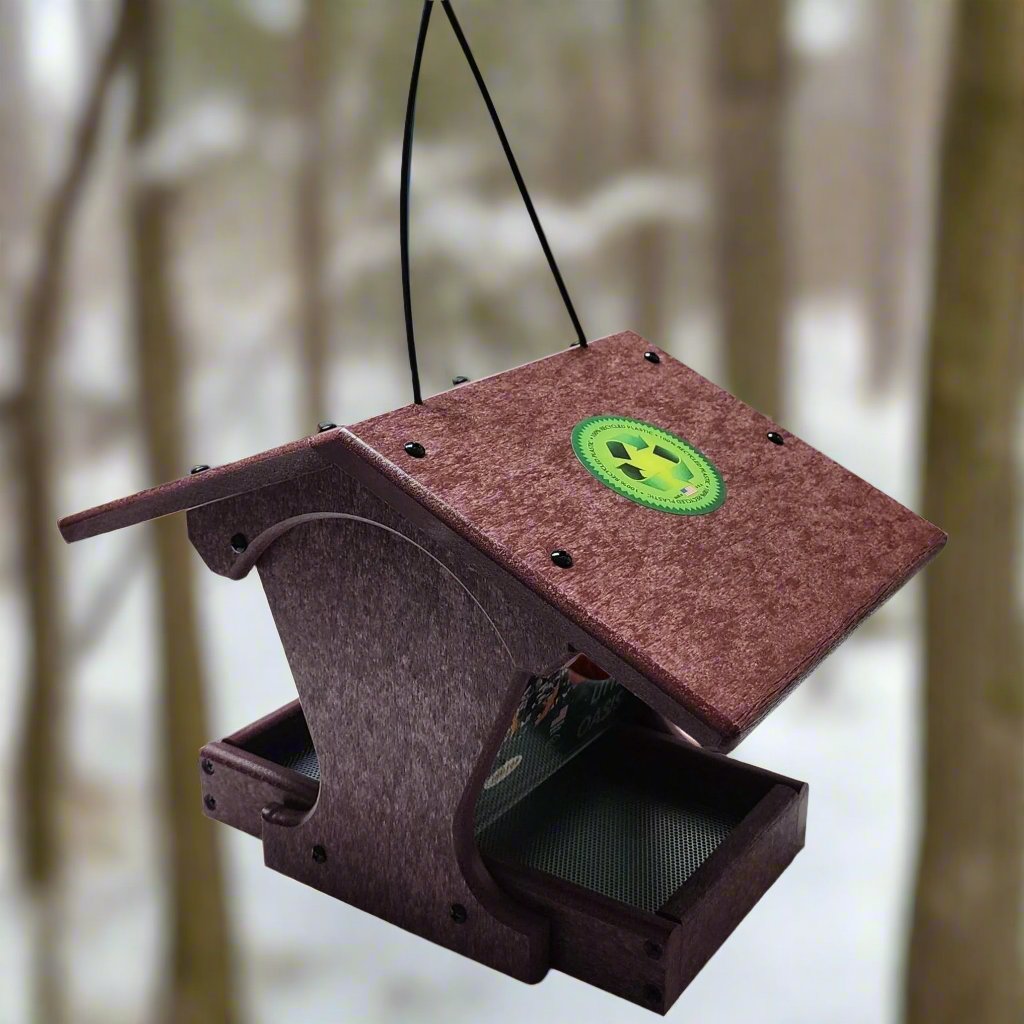 Red recycled plastic hopper feeder with black hanger. Has small tray for seed to fall into from the hopper.