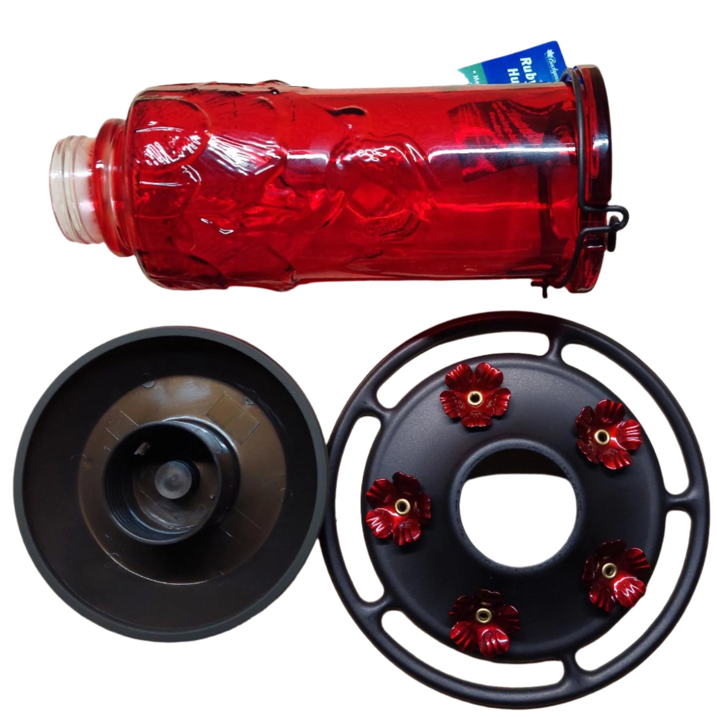 Red glass bottle with 2 dark dark base parts with red flowers