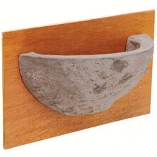 concrete half bowl mounted on tan wood