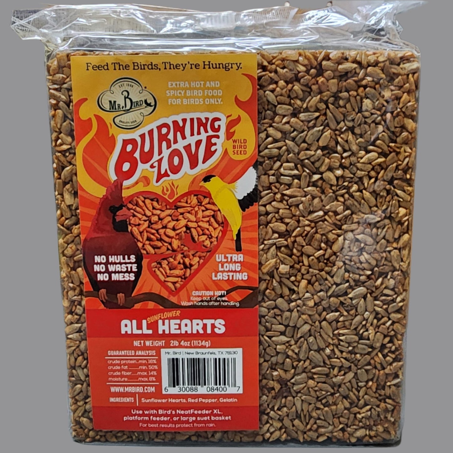 Square cake of bird seed with Burning Love on orange and red label