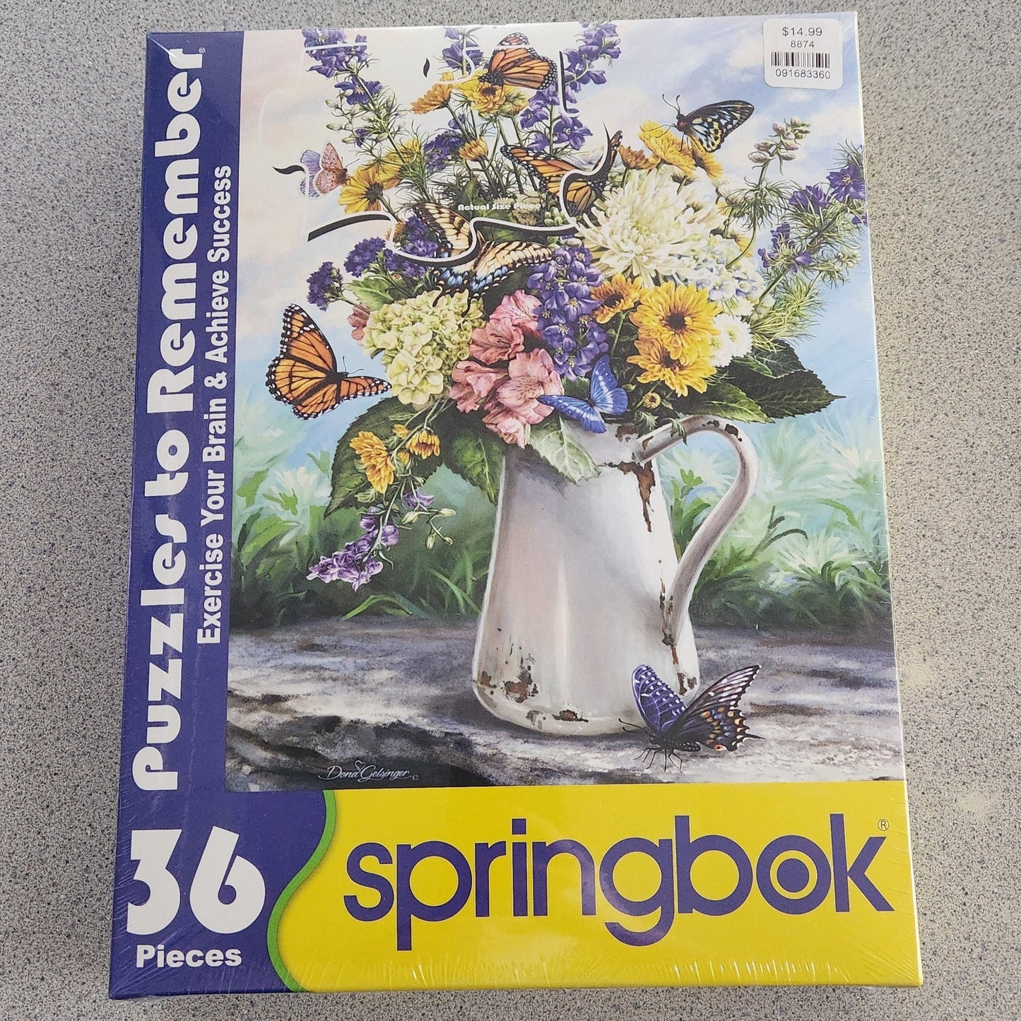 butterflies on flowers in white watering can