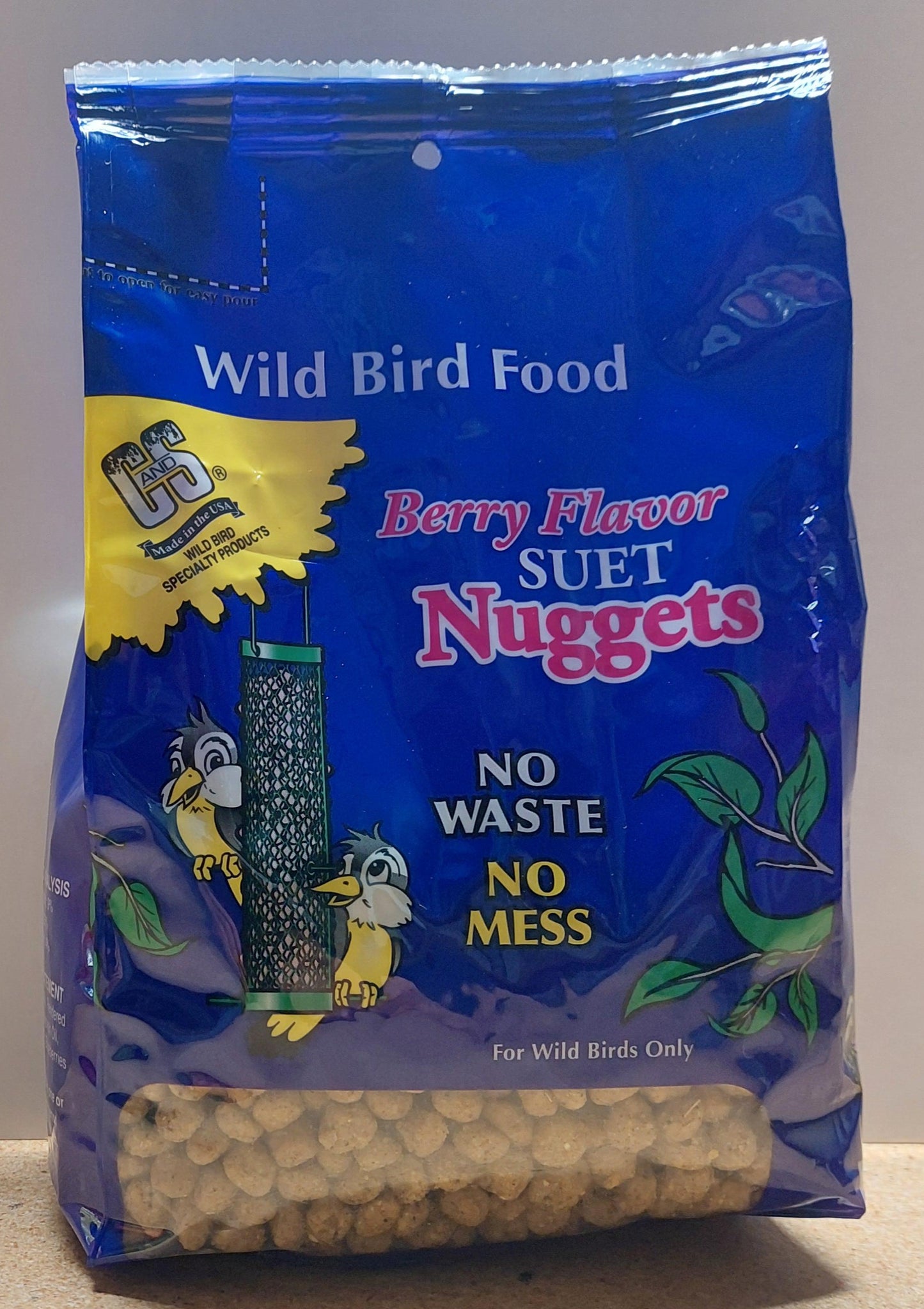 Bag of bird food with blue packaging on a neutral background