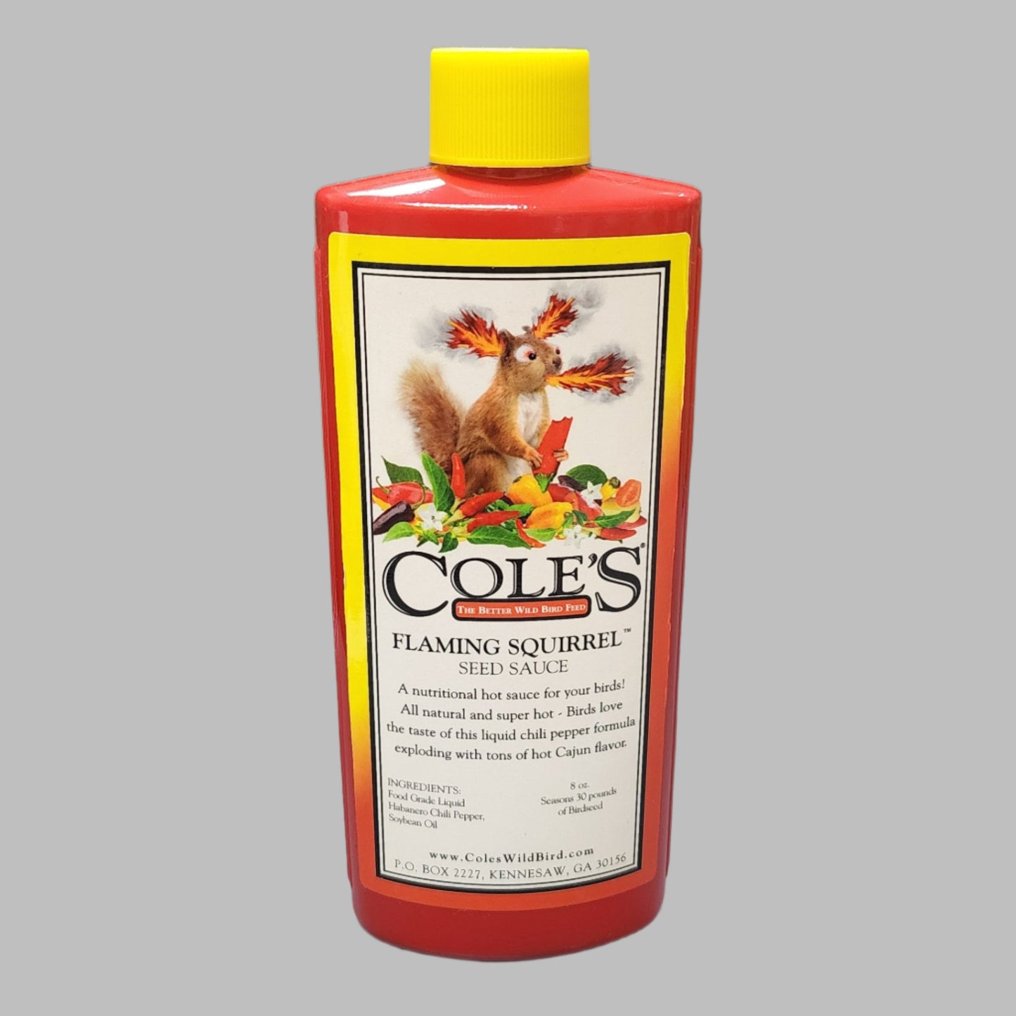Red and yellow bottle with Cole's Flaming Squirrel on label