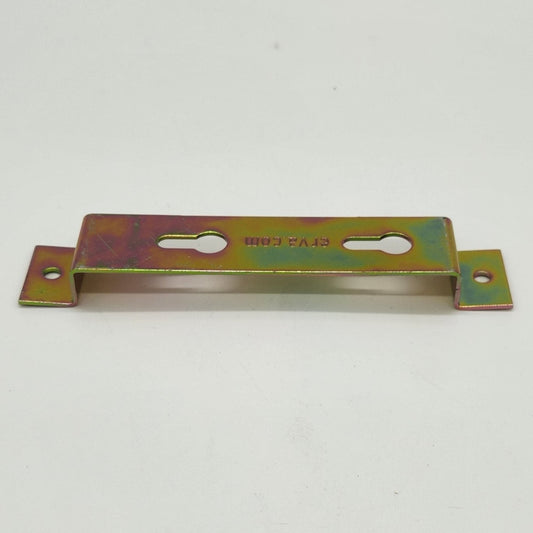 Brass piece with four holes