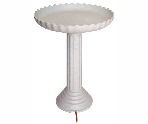 Light gray bird bath with scalloped edges and pedestal