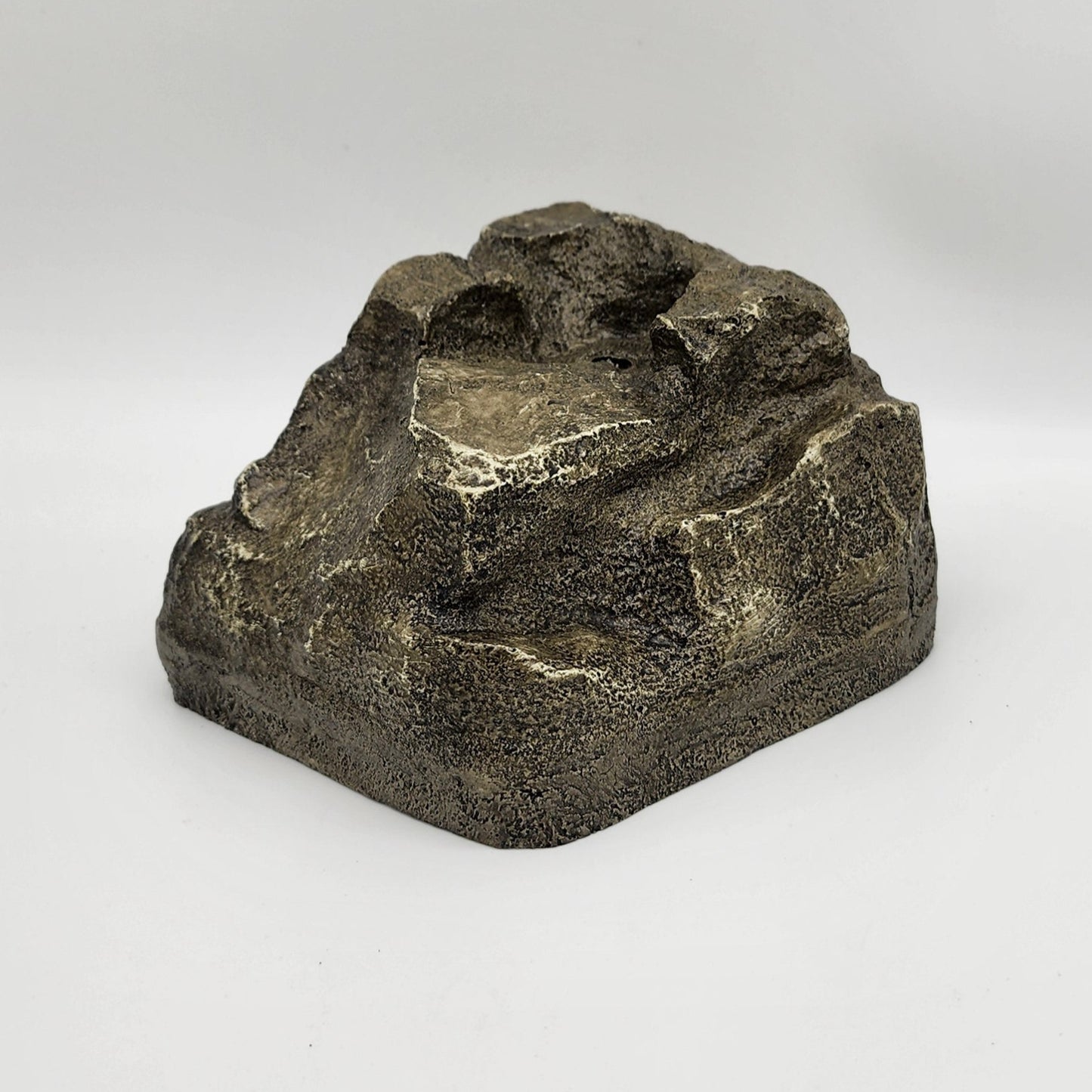 Gray faux granite rock with hole