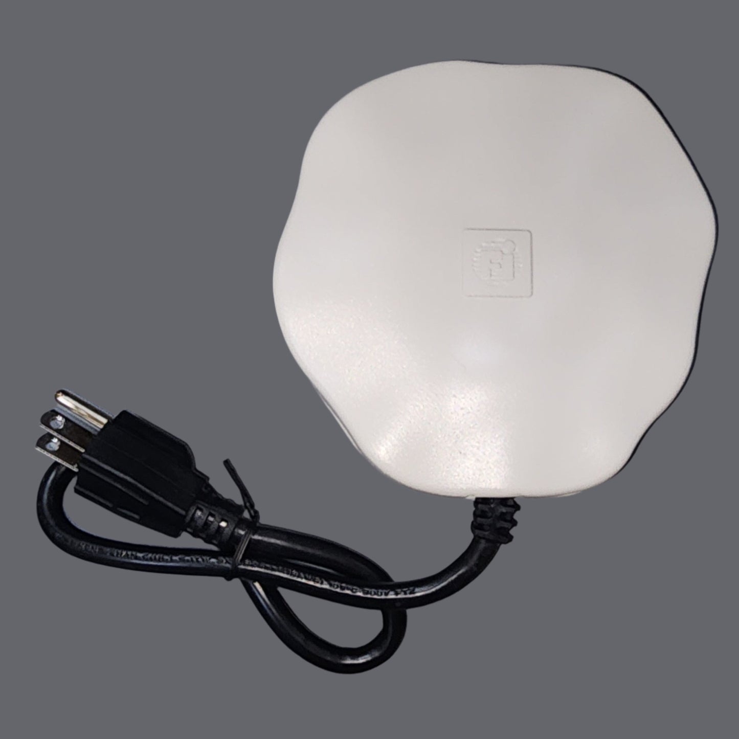 White rock shaped heater with black cord