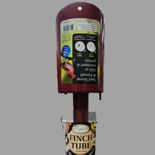 red scoop with handle in bird feeder