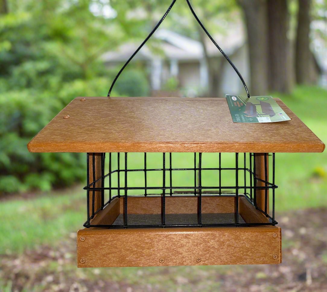 Brown fly through feeder with black dove guard attached.