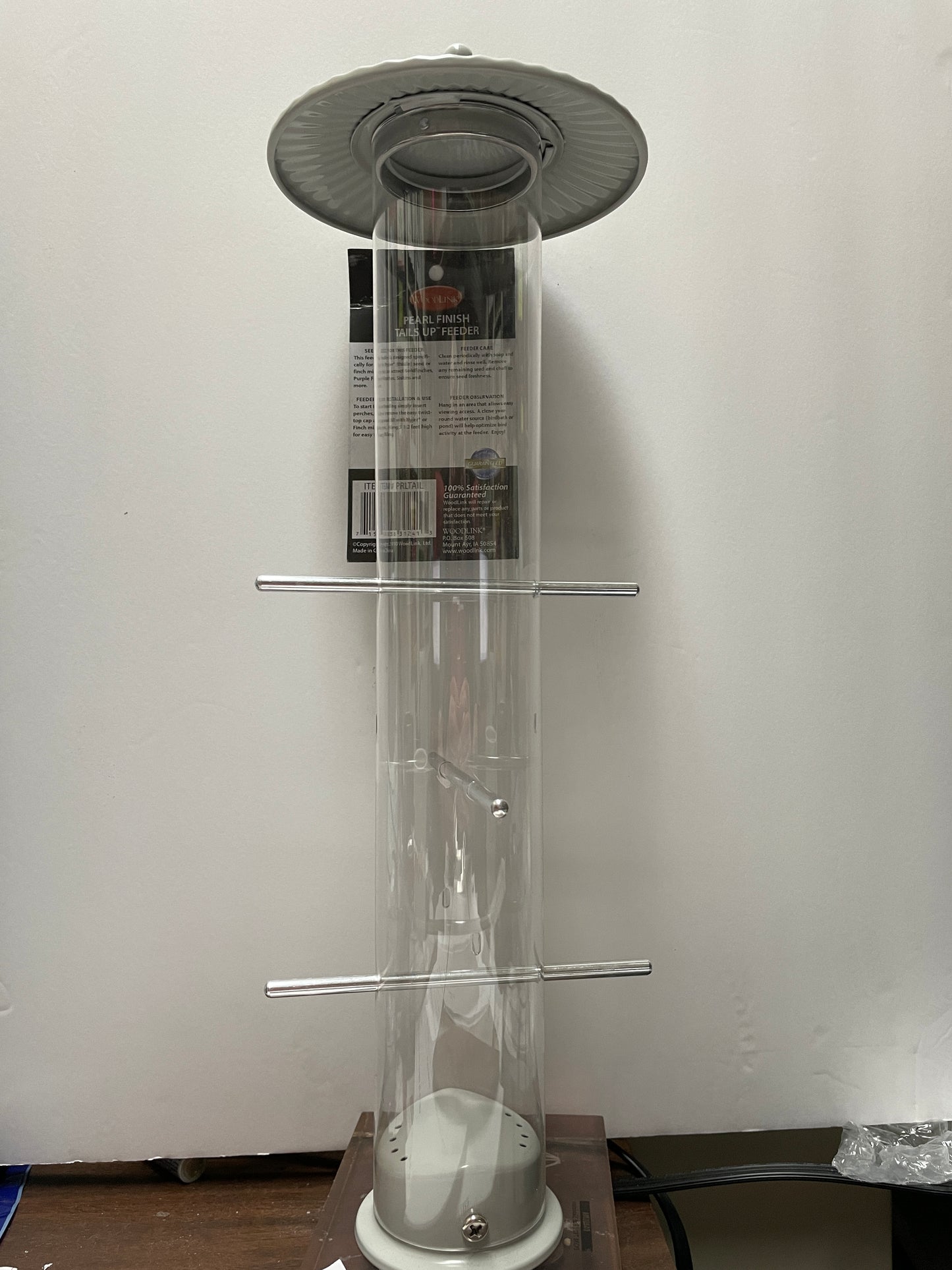 clear acrylic tube feeder with silver top and base