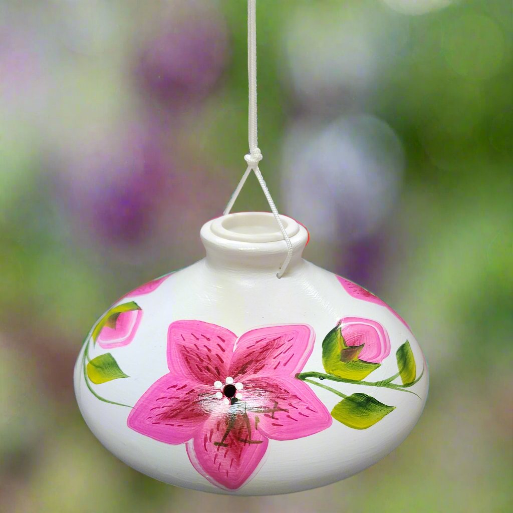 White ceramic feeder with pink flowers and leaves