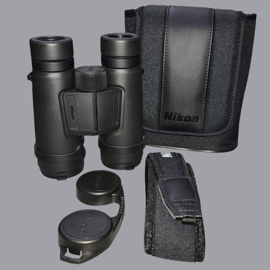 Black binoculars, case, strap and eye cup