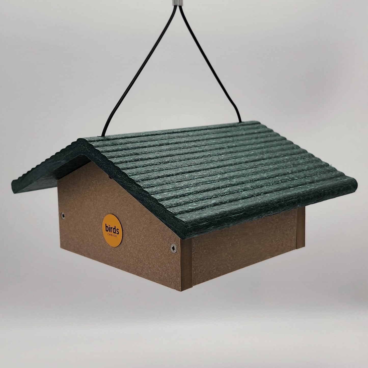 tan square feeder with green roof