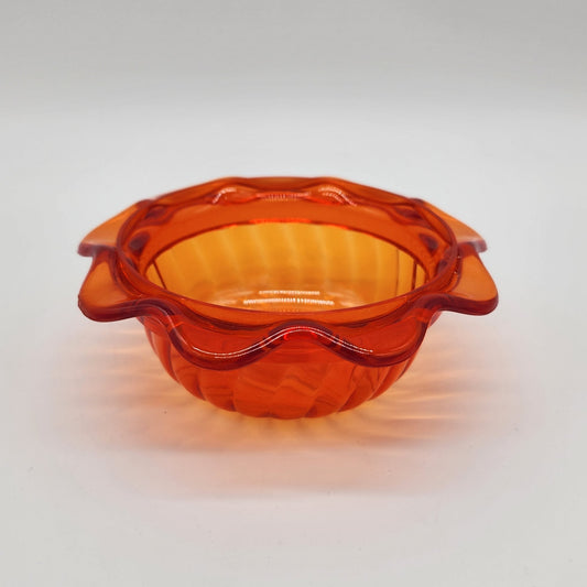orange scalloped plastic cup