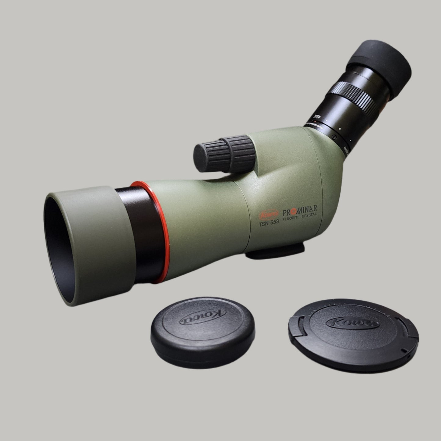 Green and black scope with black lense covers