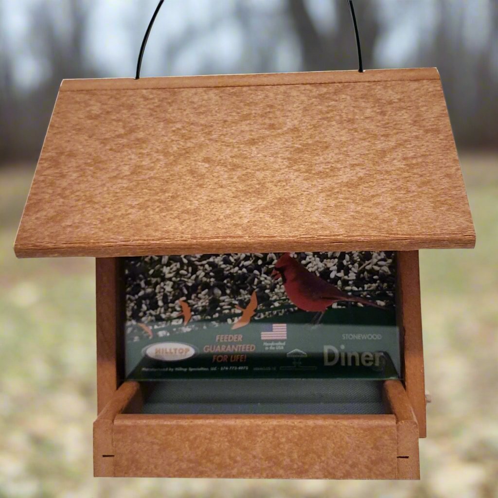 Tan colored bird feeder with silver screen base