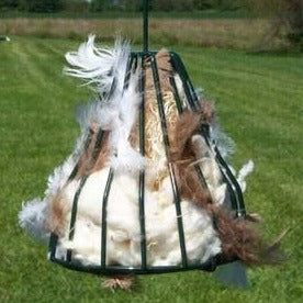 Birdie Bell filled with bird nesting material
