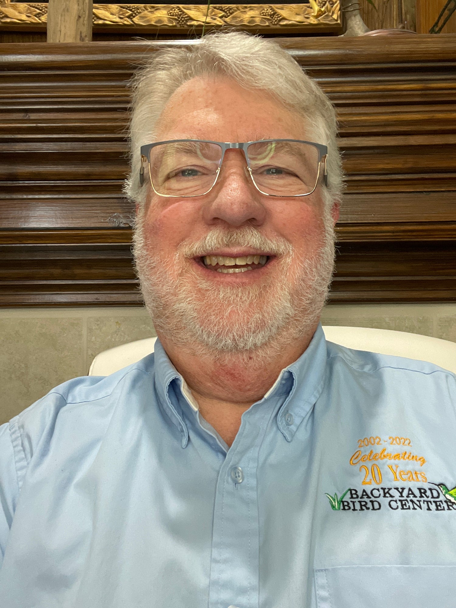 Mark headshot with blue Backyard Bird Center shirt