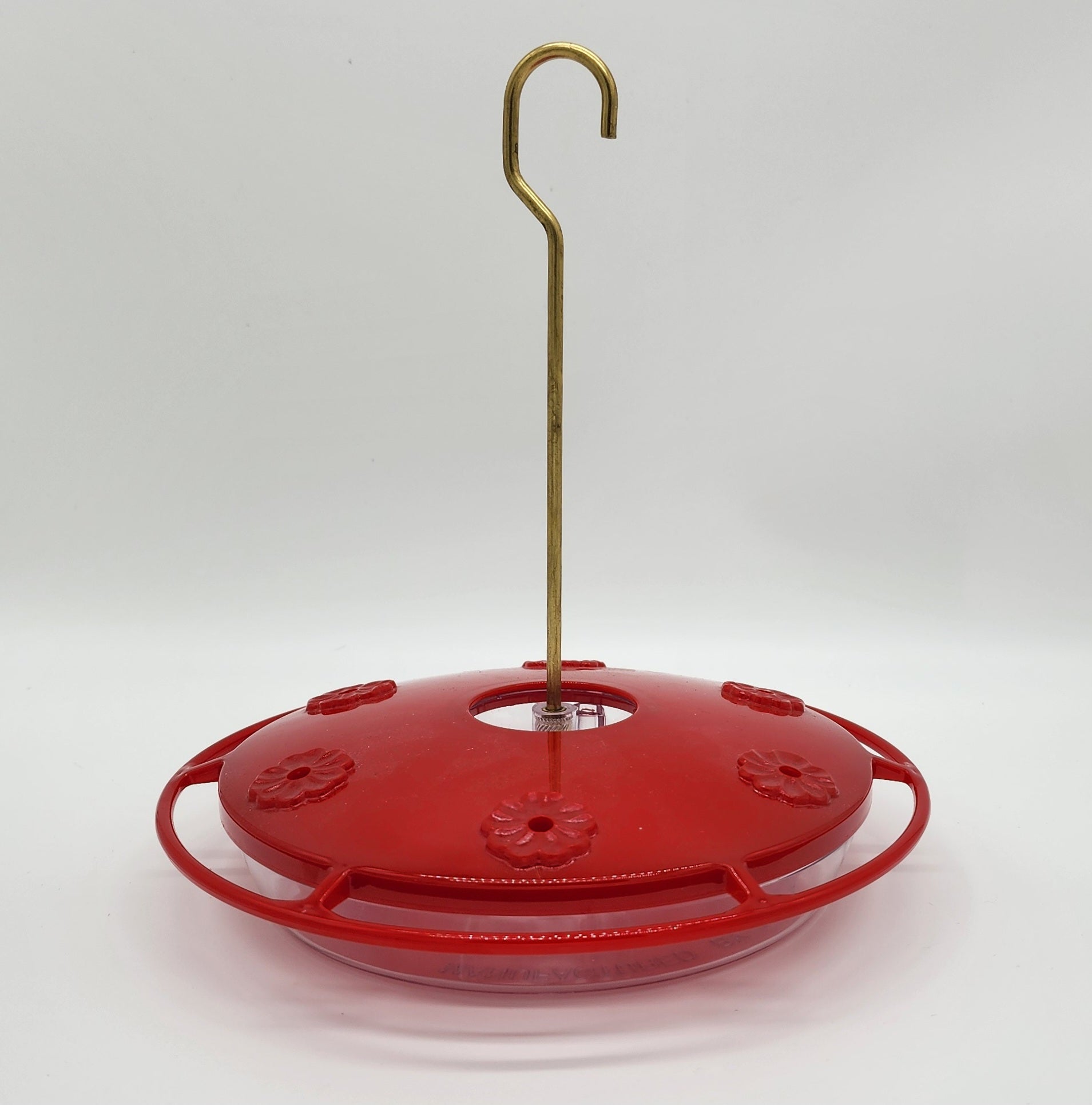 Saucer type Humming bird feeder. Red lid with clear dish