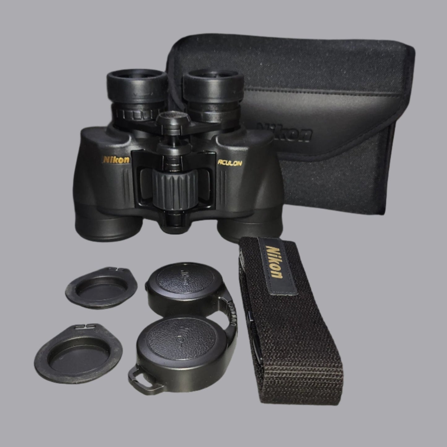 Black binoculars, case, strap and eyecups