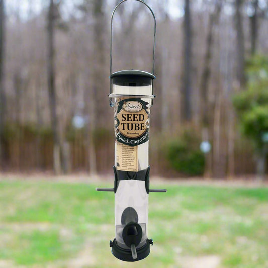 Clear seed feeder with green top, base and ports