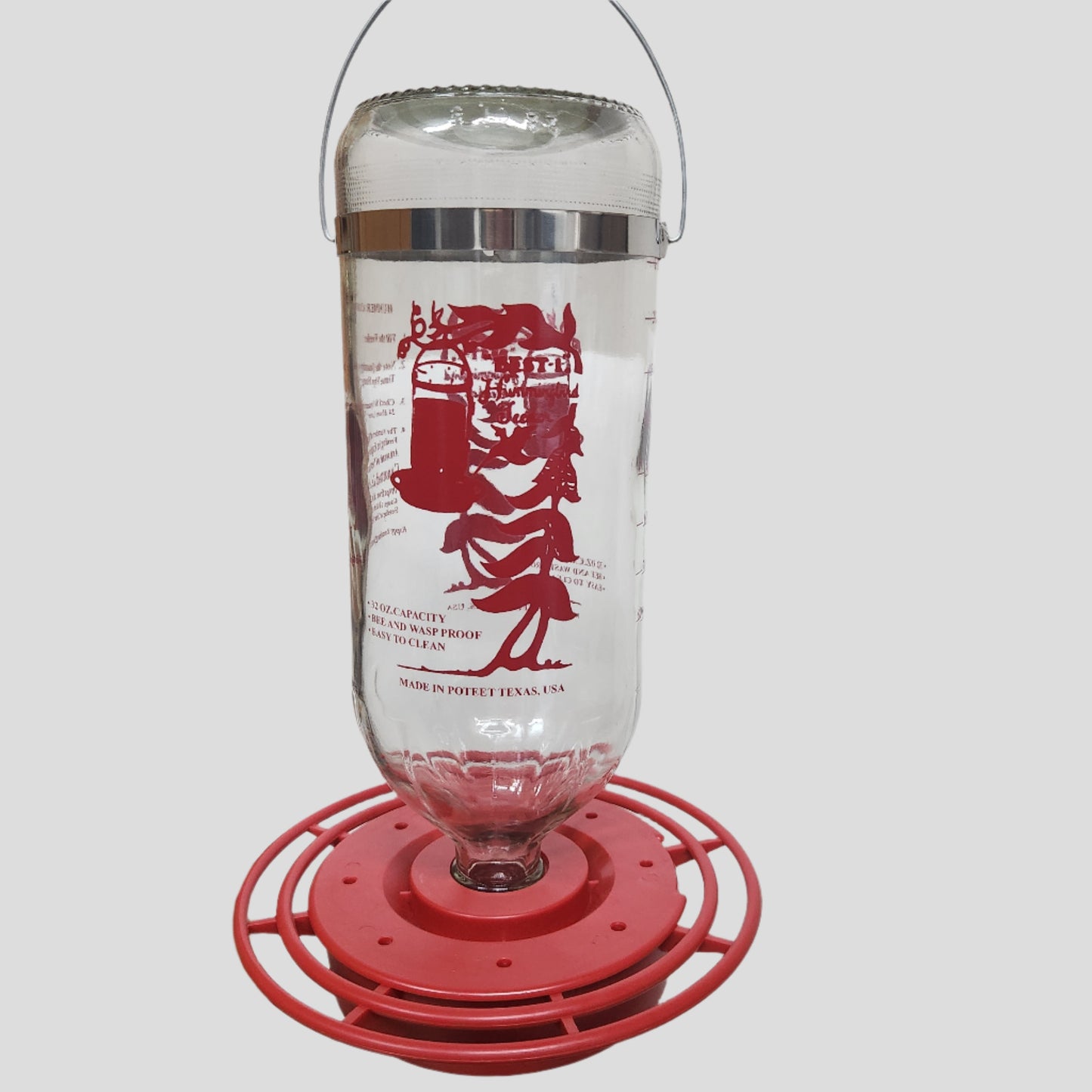 Clear bottle with red image and base