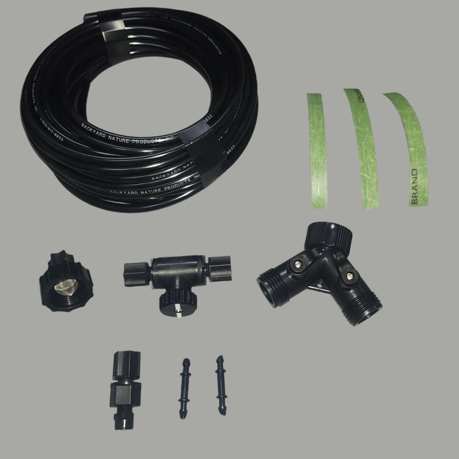 Black hose and parts with green tape