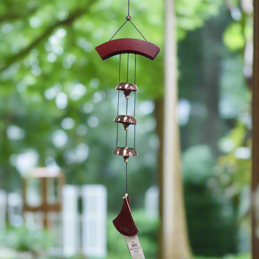 wind chime with curved wood top and paddle and three copper bells