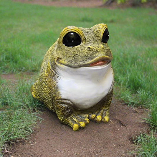 green and white frog yard ornament