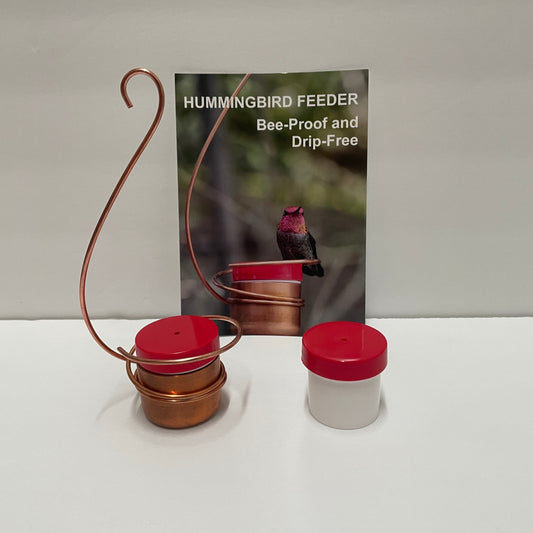 spiral copper hummingbird feeder with red lid