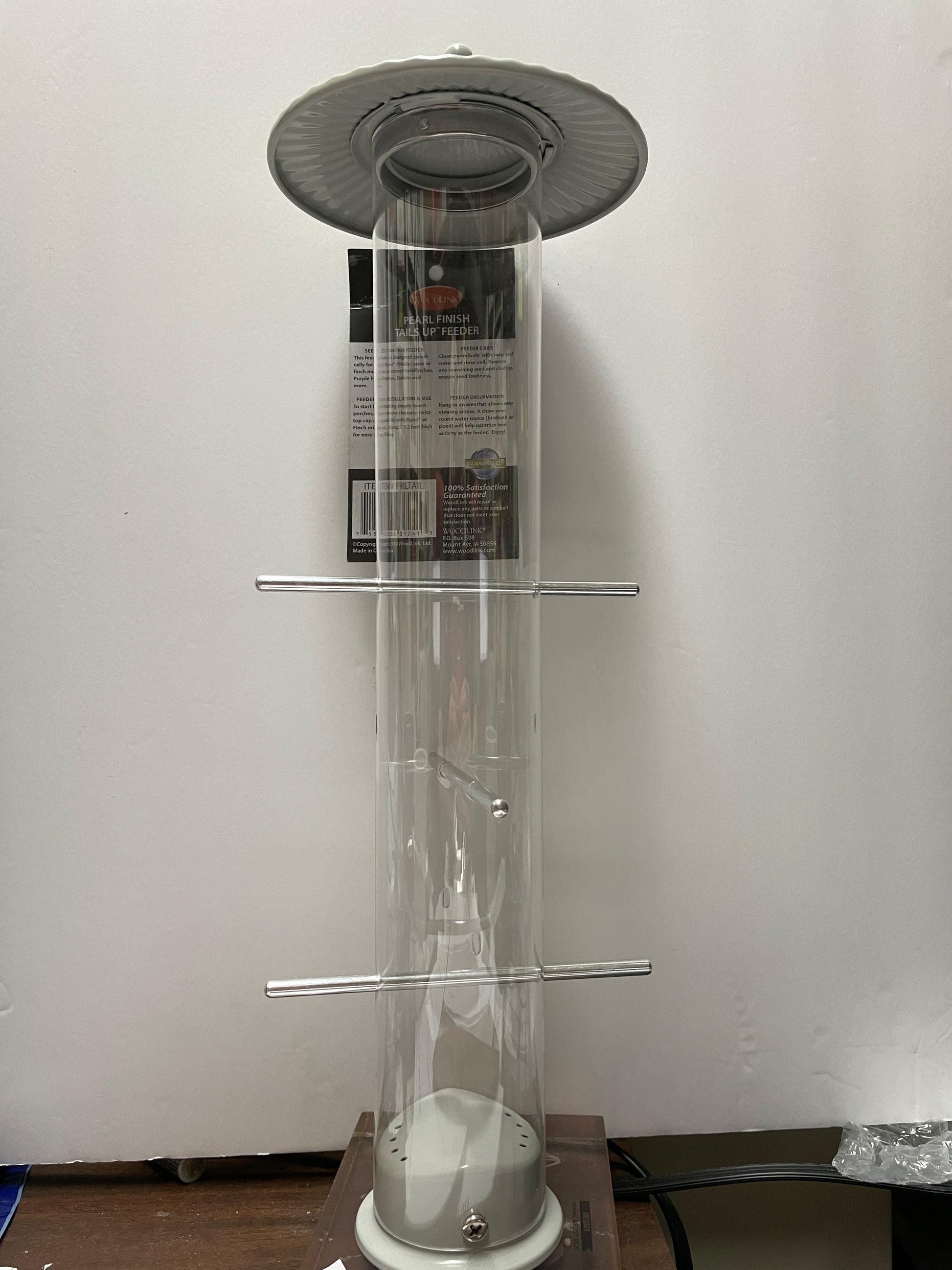 clear acrylic tube feeder with silver top and base