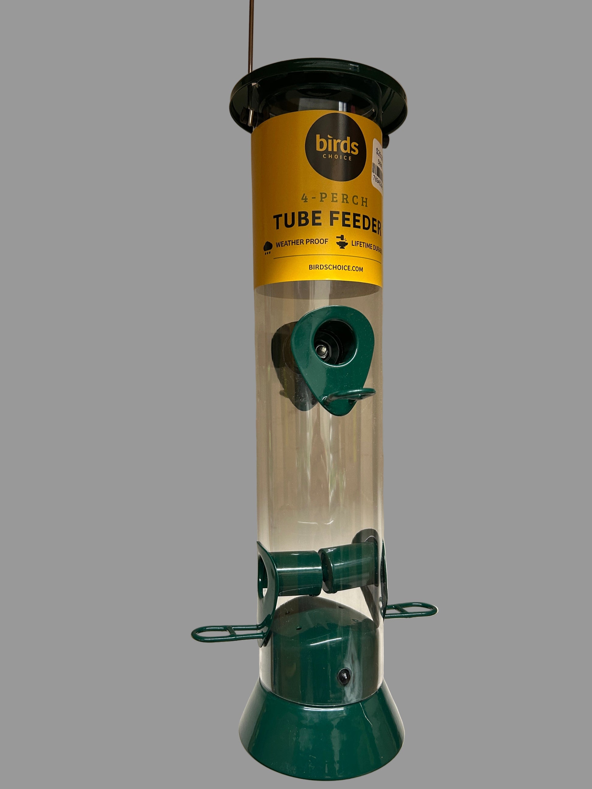 Green bird feeder with yellow label on a white background