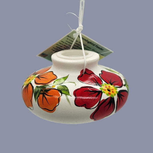 White ceramic feeder with painted orange and red flowers