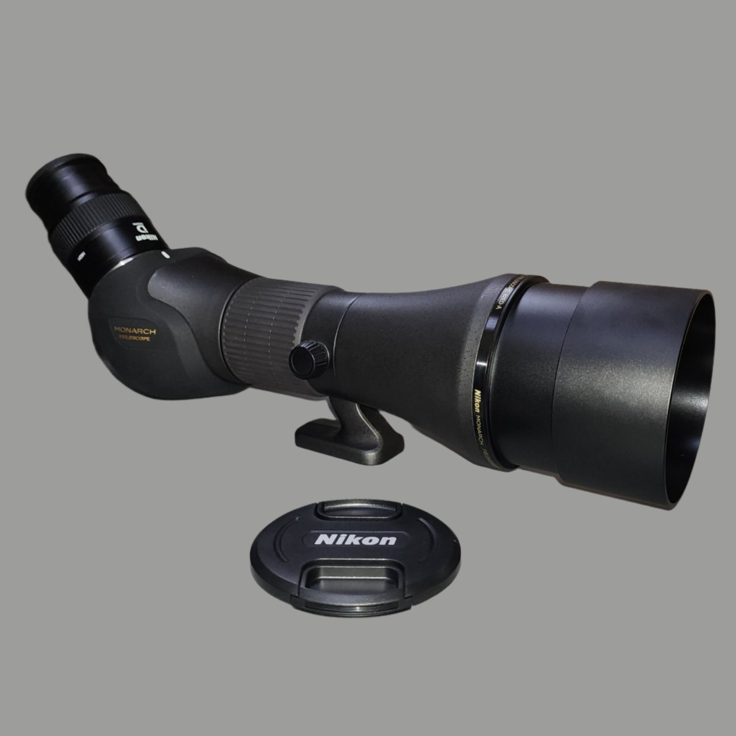 Black spotting scope with lens cover