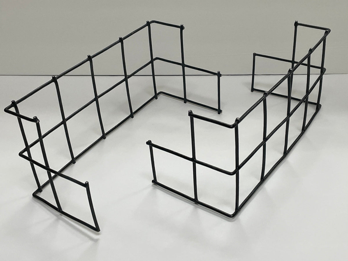 A black metal wire shelving organizer with a rectangular grid design, shown on a white tabletop with a white background.