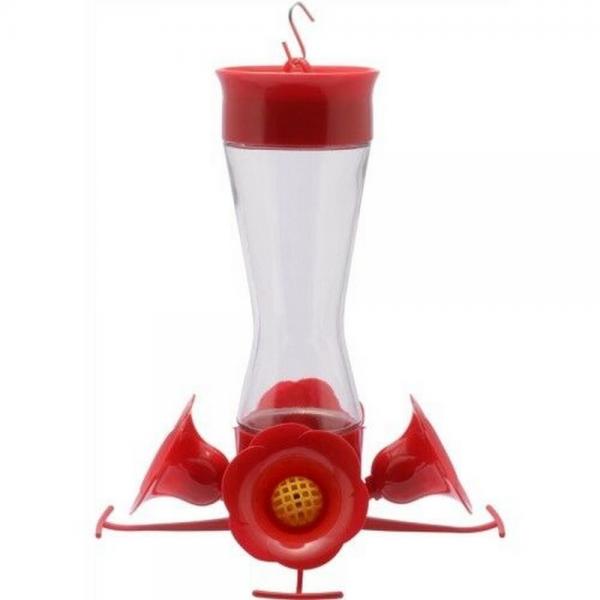 Clear glass hummingbird feeder with red top and 4 flower bottom