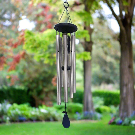 wind chime wiht 6 silver tubes and 5 small black inner tubes. Black top and paddle