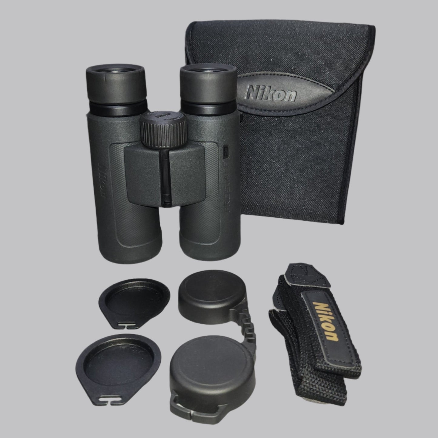 Black binocular, case, strap and lense covers