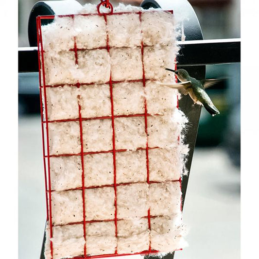 Red wire grid with cotton and a hummingbird