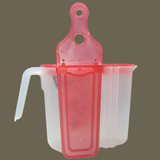 clear pitcher with red lid and paddle