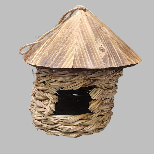 tan grass circular pocket with square opening and wood roof