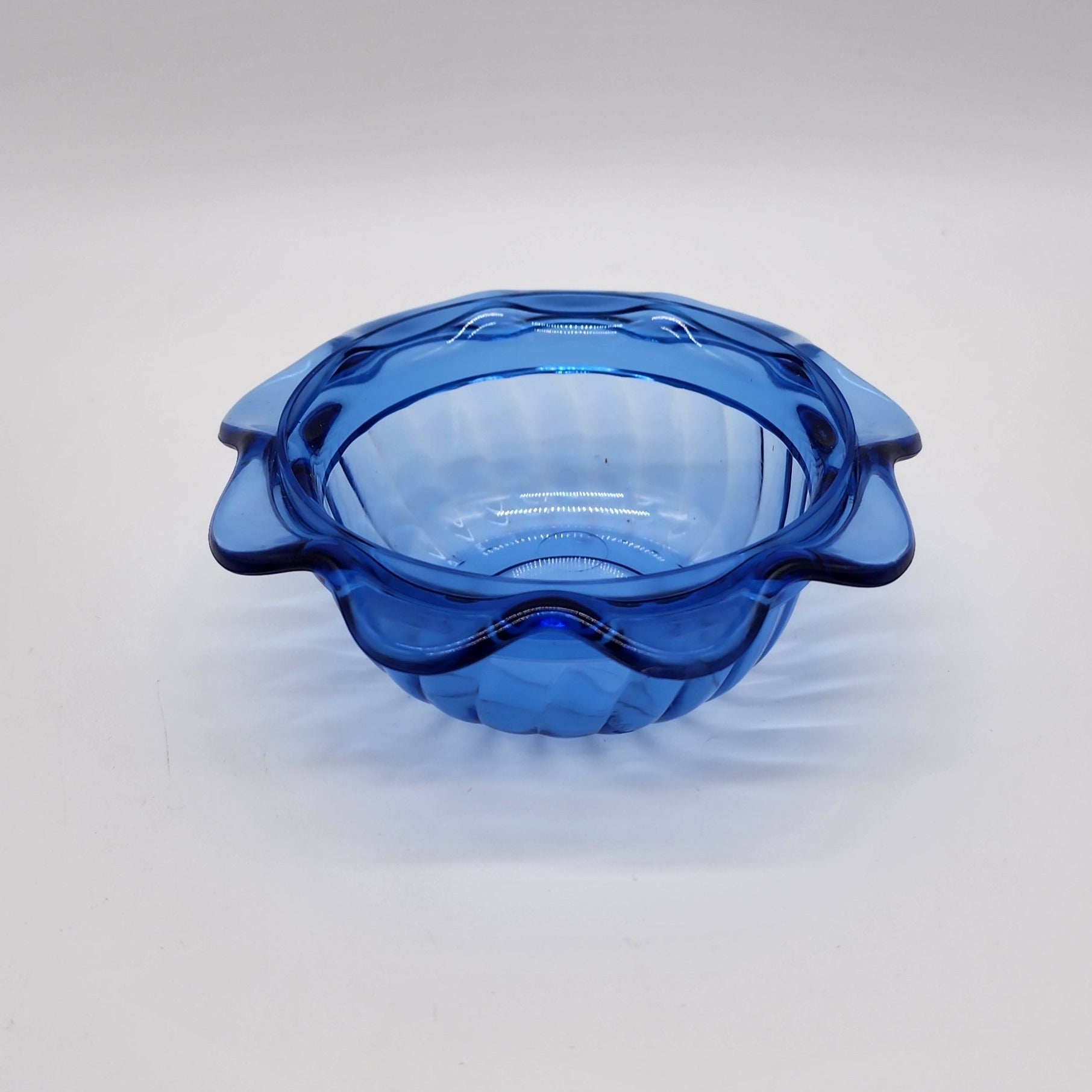 blue scalloped plastic cup