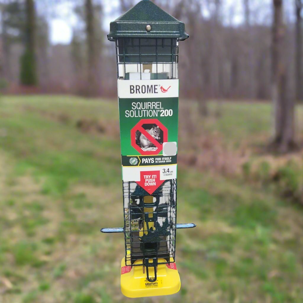 Square green wire feeder with yellow funnel stored in bottom