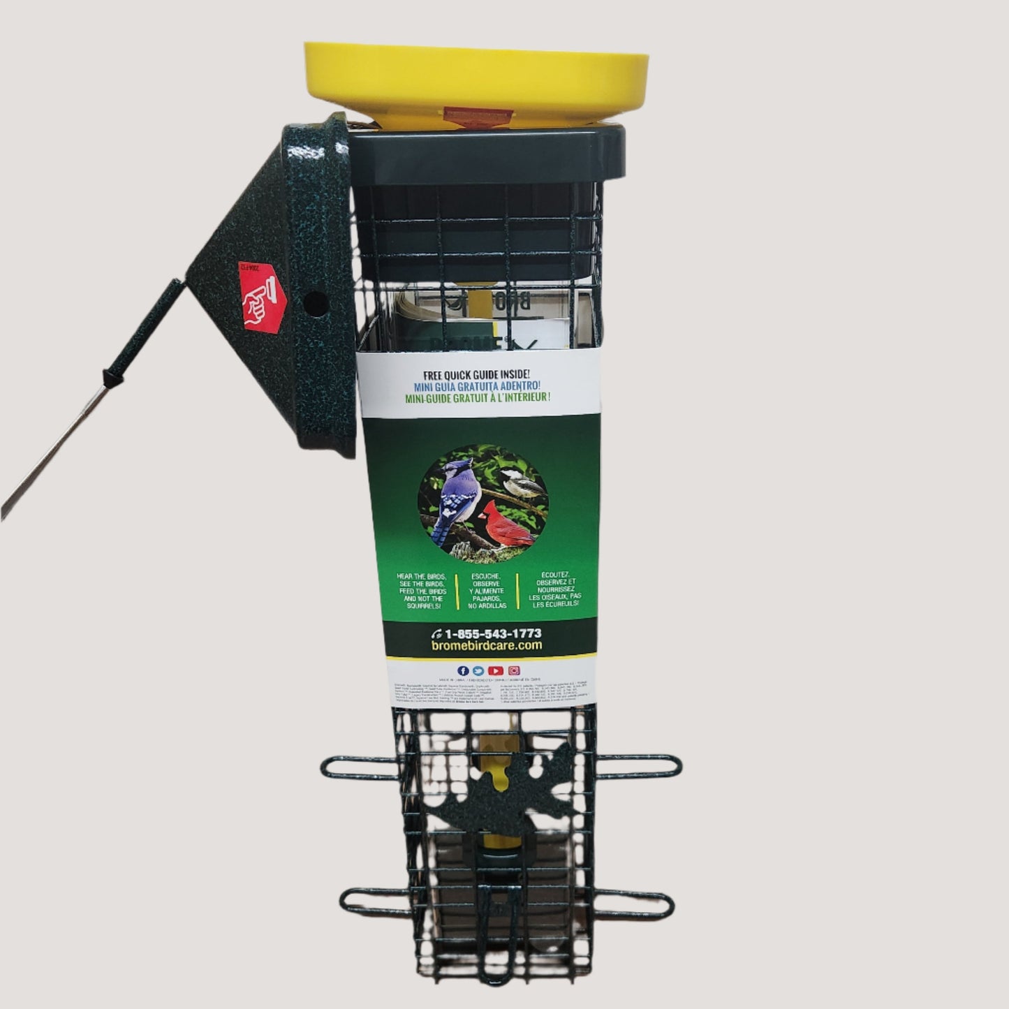 Square green wire feeder with yellow funnel in top