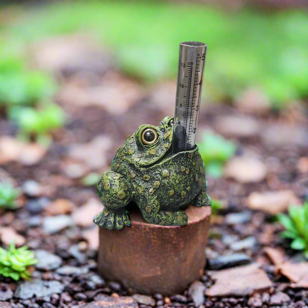 dark green toad with clear glass rain gauge tube