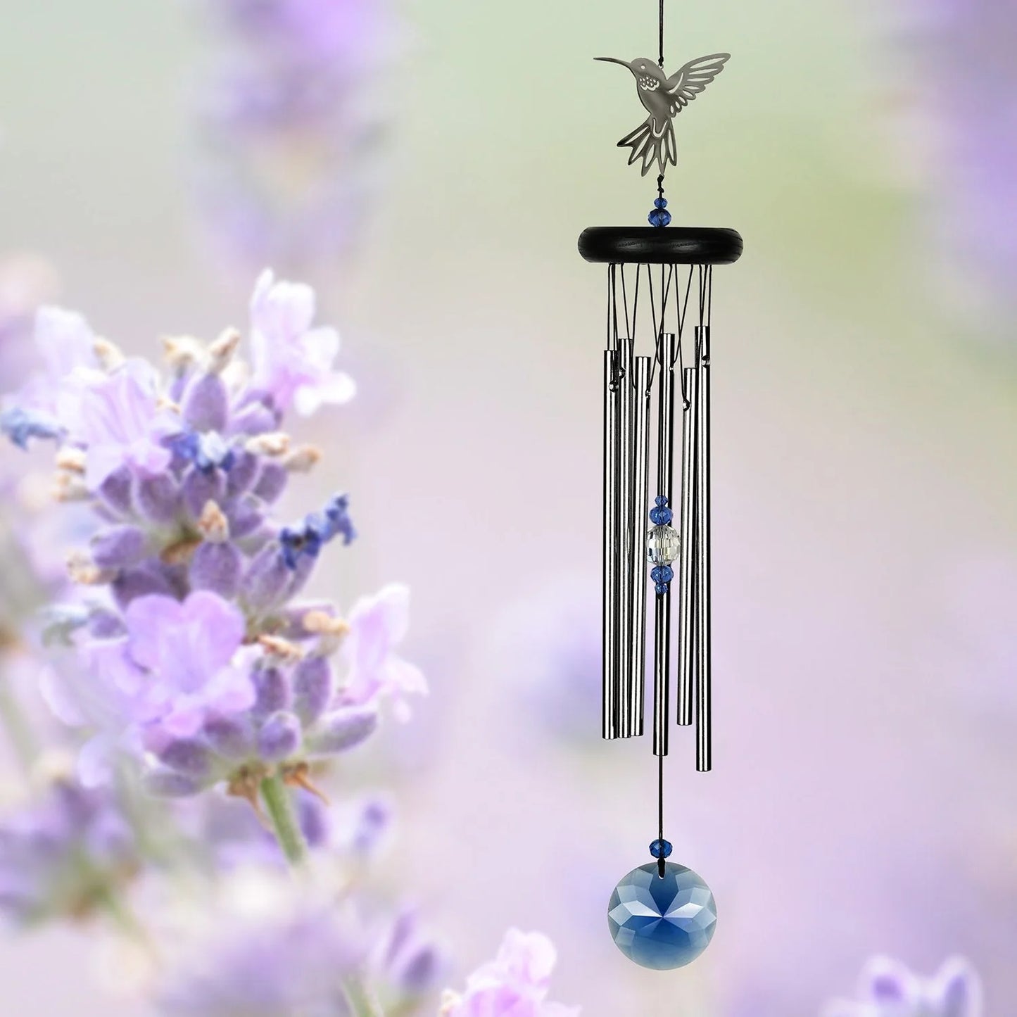 Silver wind chime with blue crystal paddle and silver hummingbird topper