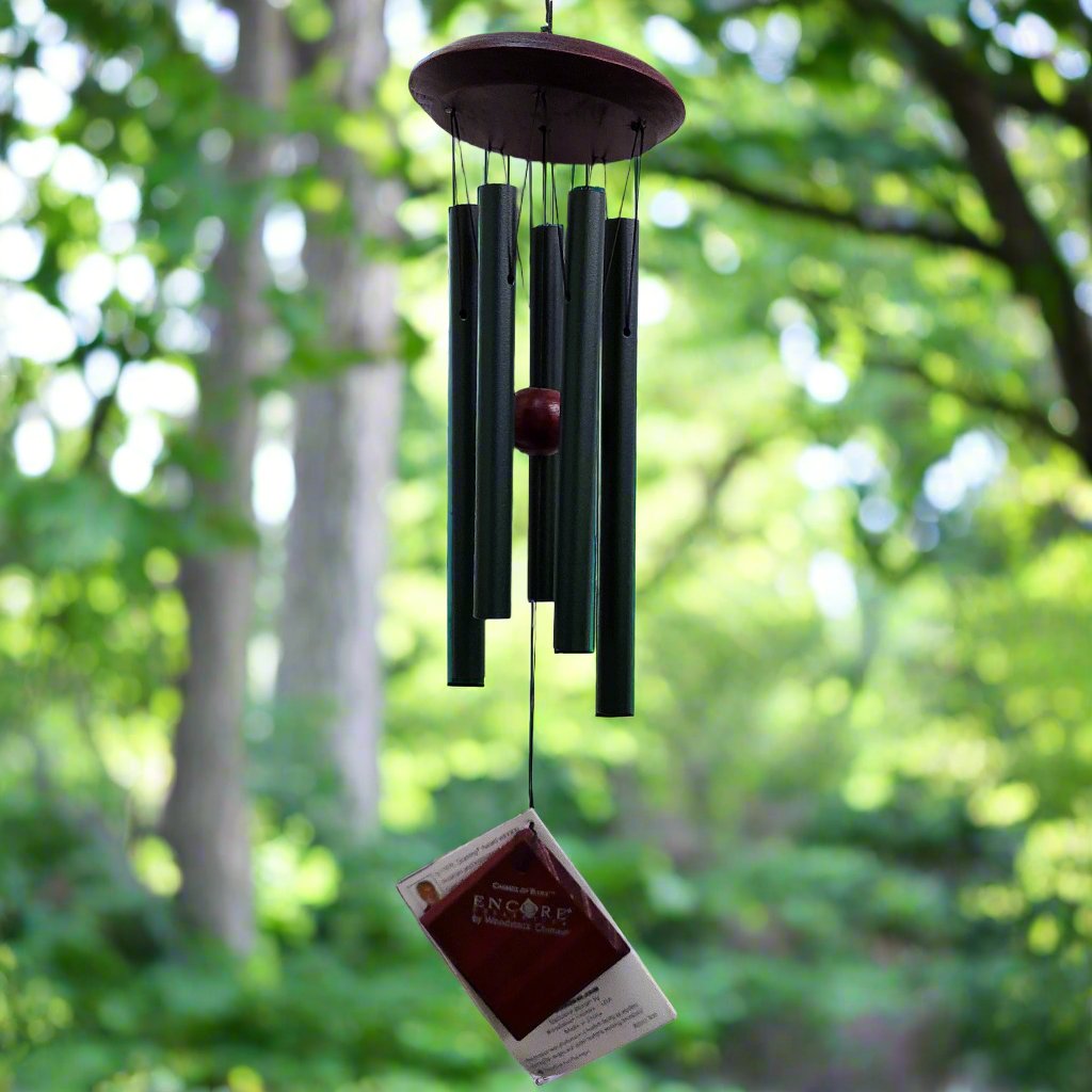 Wind chime with green pipes and wood top and paddle