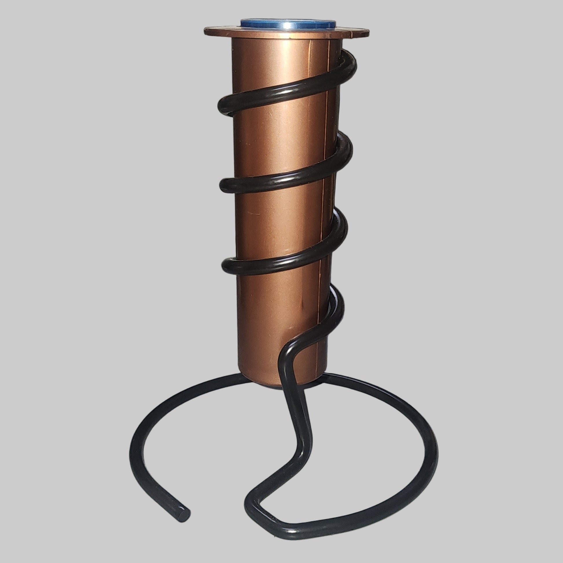 Copper rain gauge tube with black spiral holder and base